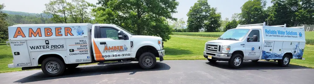 Well Manager® Truck and Amber Water Pros Trucks parked outside residential install